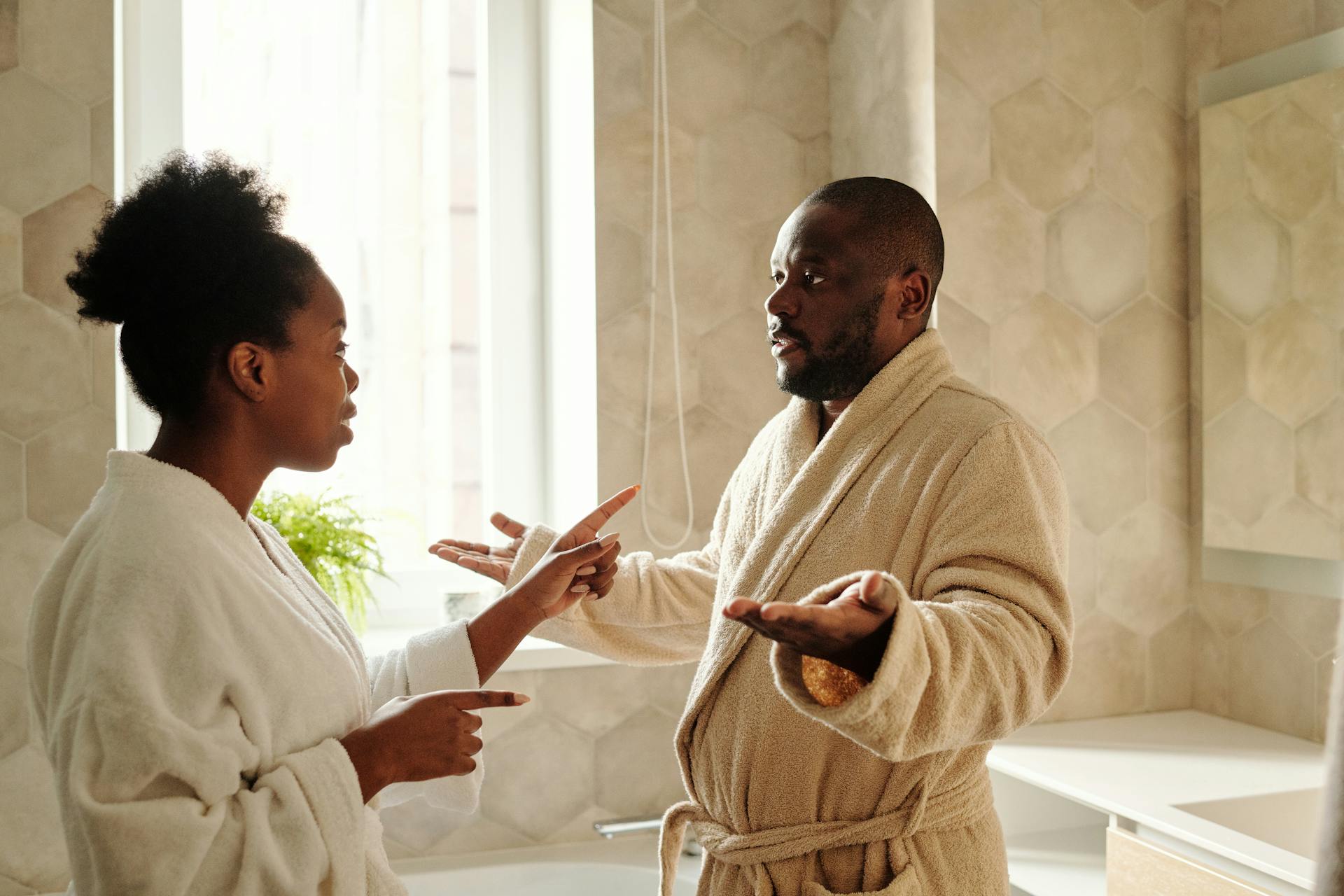 black couple arguing in a bathroom