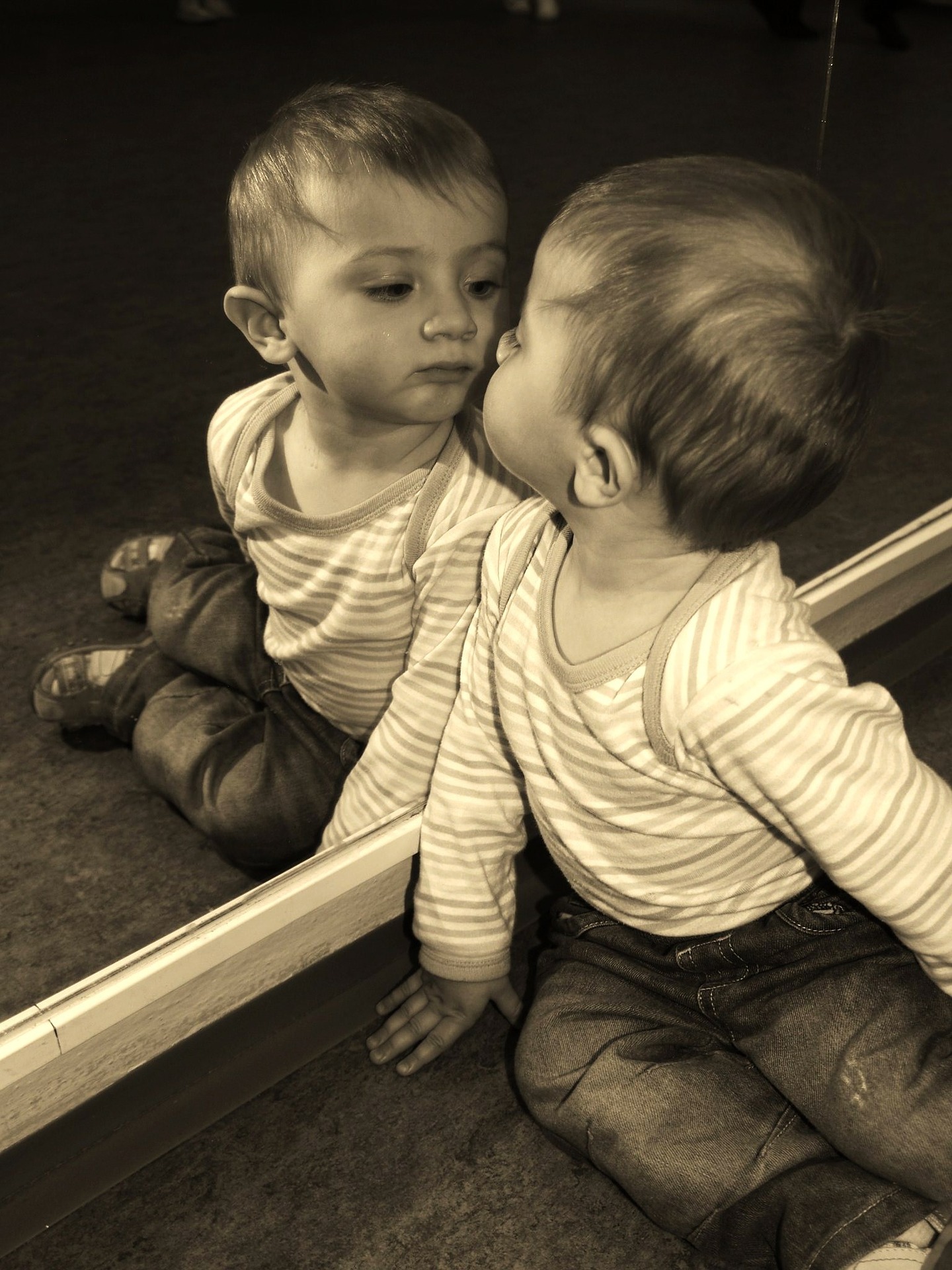 child looking at their reflection