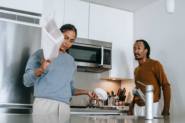woman ignoring husband as he argues with her