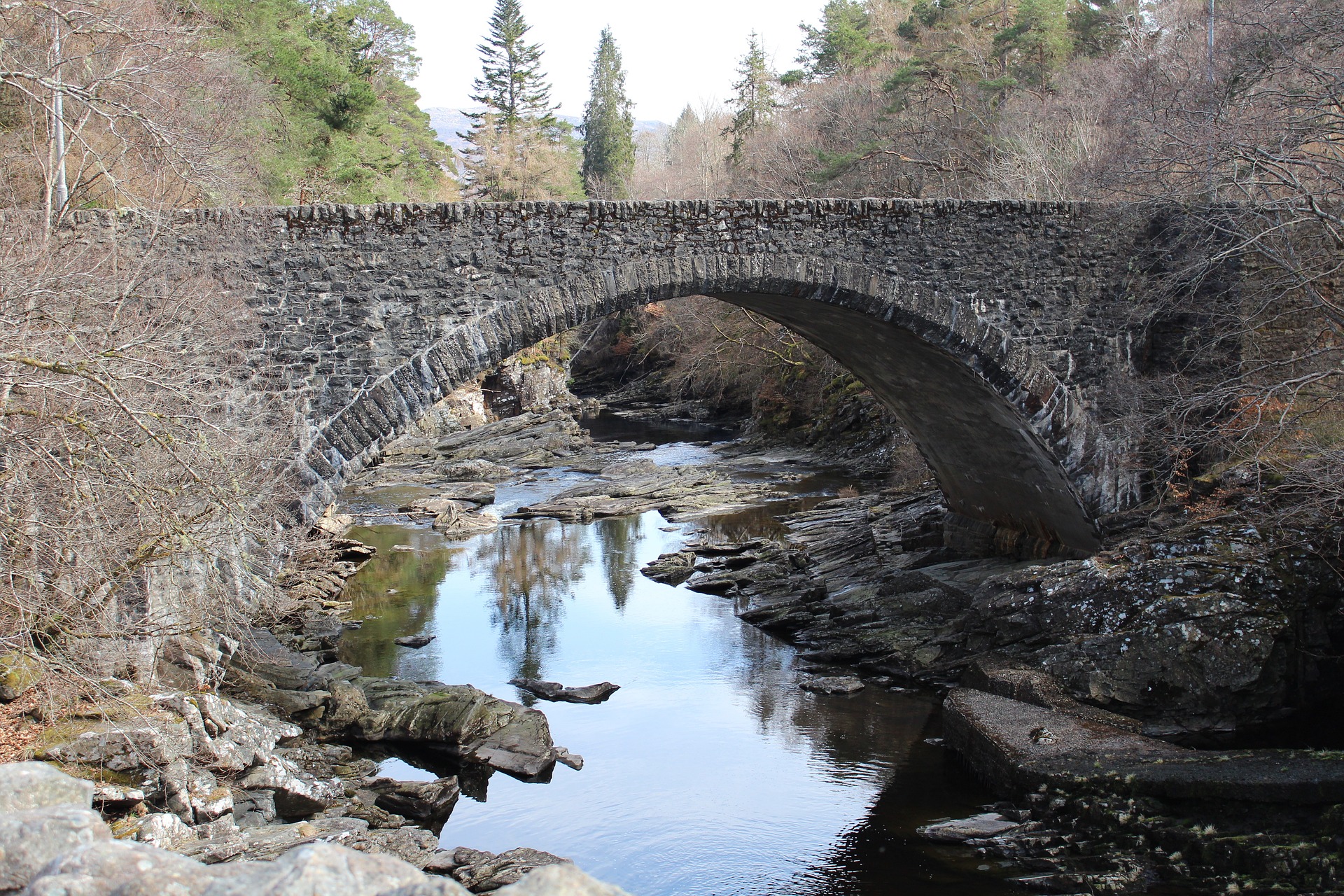 Old stone bridge across a river