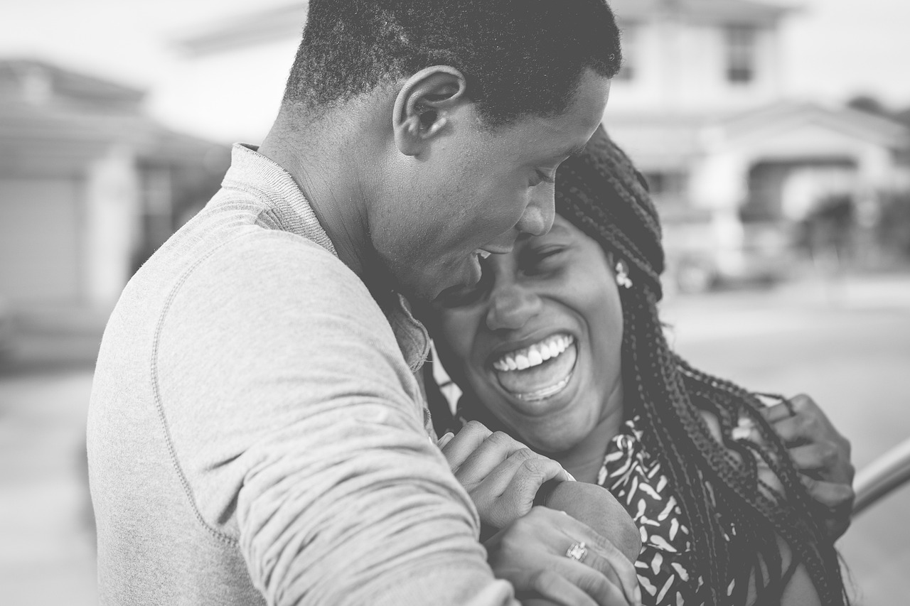 Black man & woman in a loving embrace