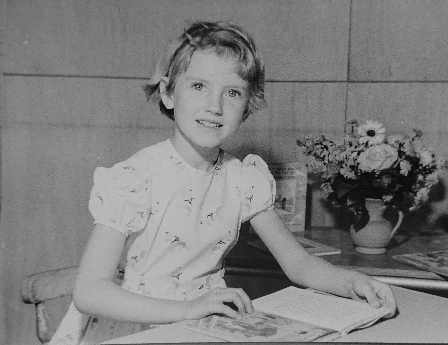 Sorrel as a little girl reading a book