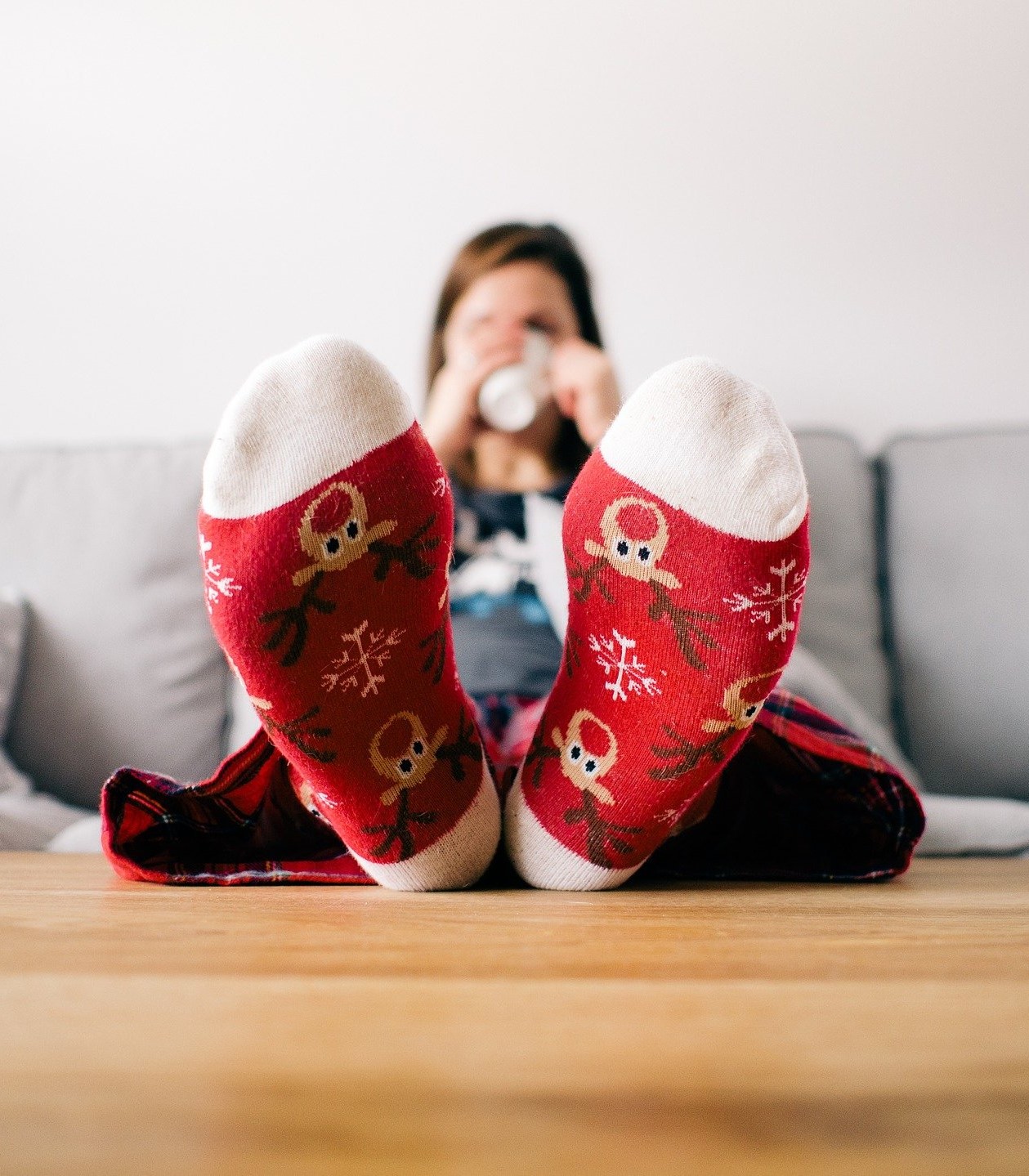 woman with feet up & a hot drink